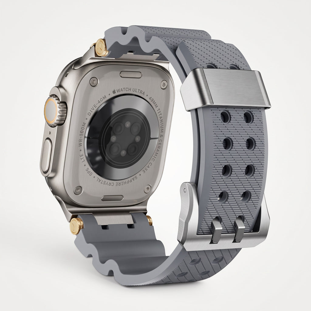 Clipz It Aureus grey silicone watch band with 18k gold-plated accents attached to an Apple Watch Ultra