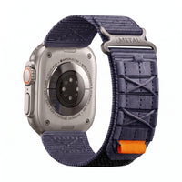 Clipz It Expedition navy blue nylon watch strap with velcro closure attached to an Apple Watch Ultra titanium case