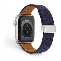 Clipz It perforated navy blue leather Apple Watch band with tan interior lining and magnetic clasp.
