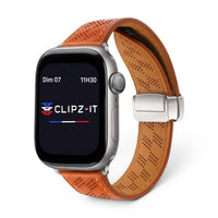 Clipz It tan perforated leather watch band with magnetic clasp on an Apple Watch, featuring a racing-inspired design.